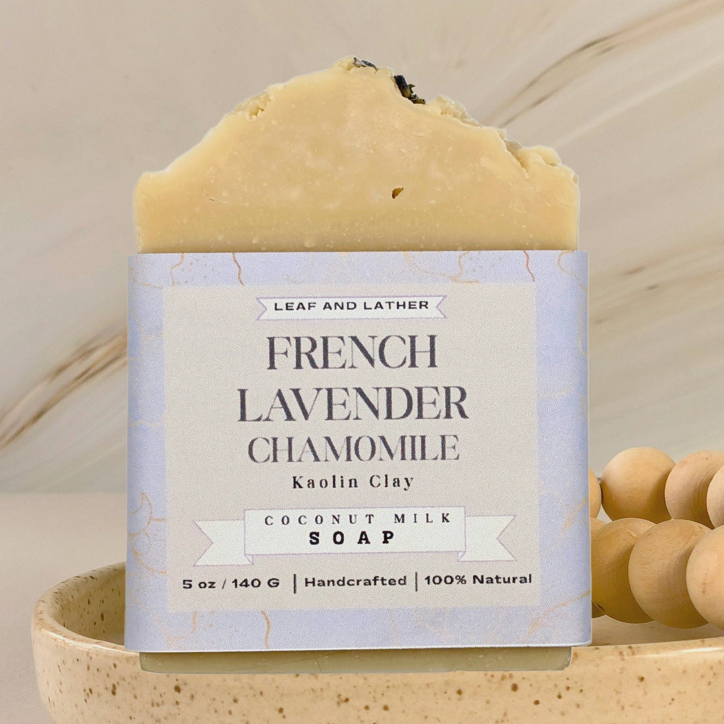 Bar of soap with a label on a beige background
