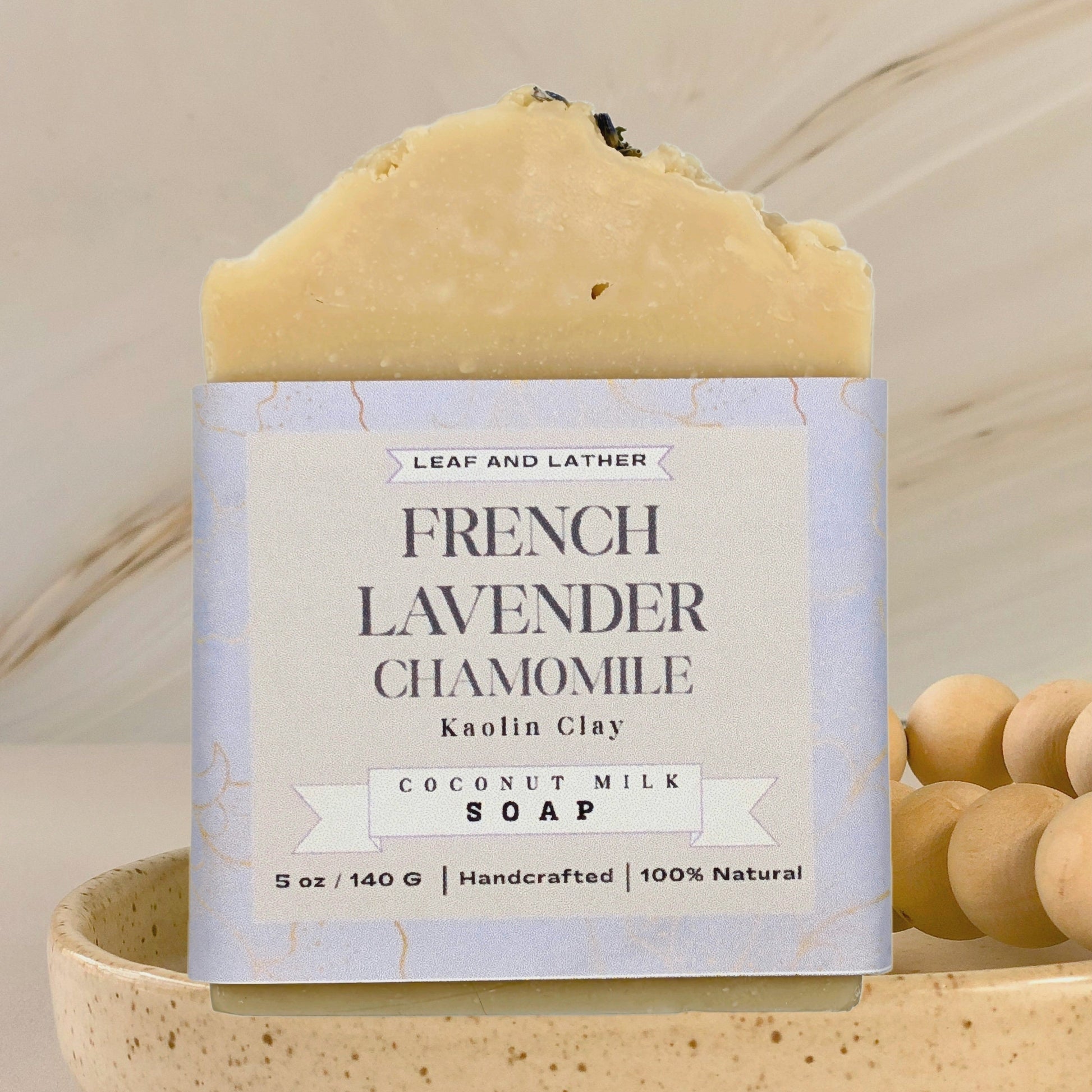 Bar of soap with a label on a beige background