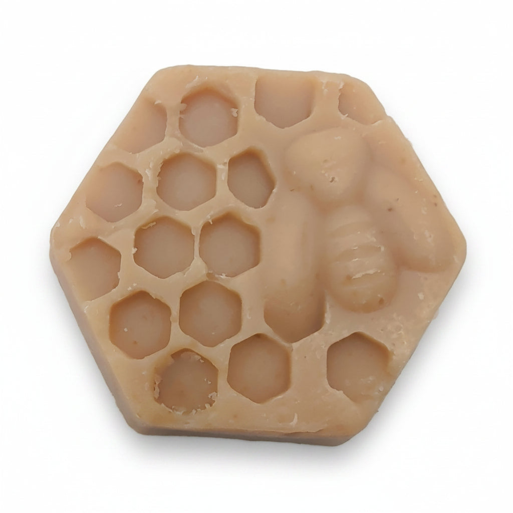 Hexagonal honeycomb-shaped object on a white background